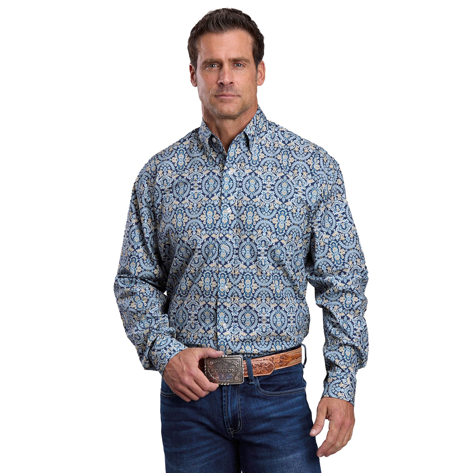 Man wearing a blue patterned shirt and jeans on a white background