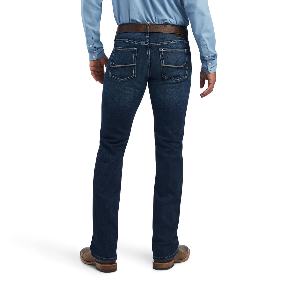 Person wearing dark blue jeans and a light blue shirt on a white background