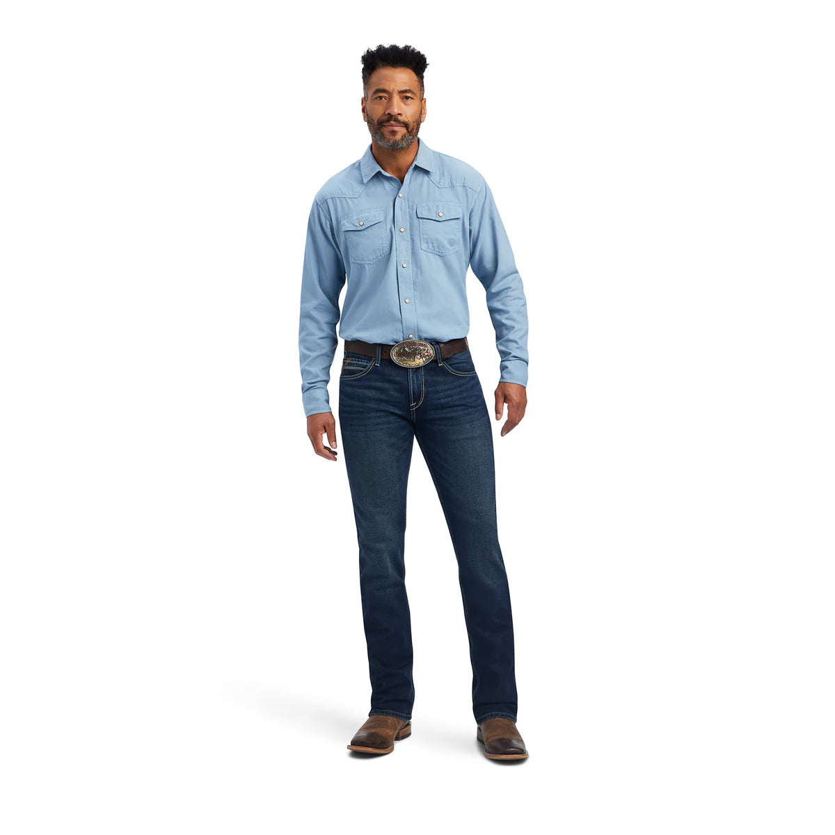 Man wearing a light blue shirt and dark blue jeans on a white background
