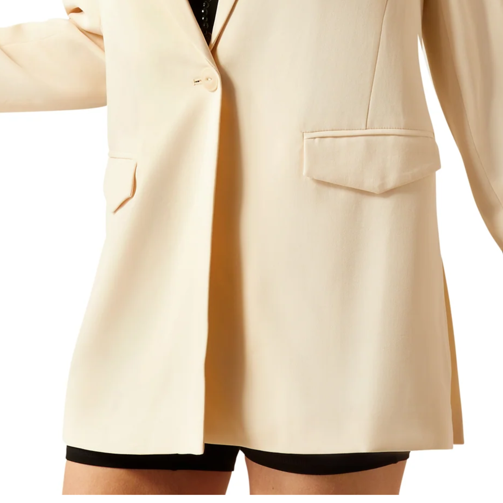 Beige blazer worn by a person on a white background