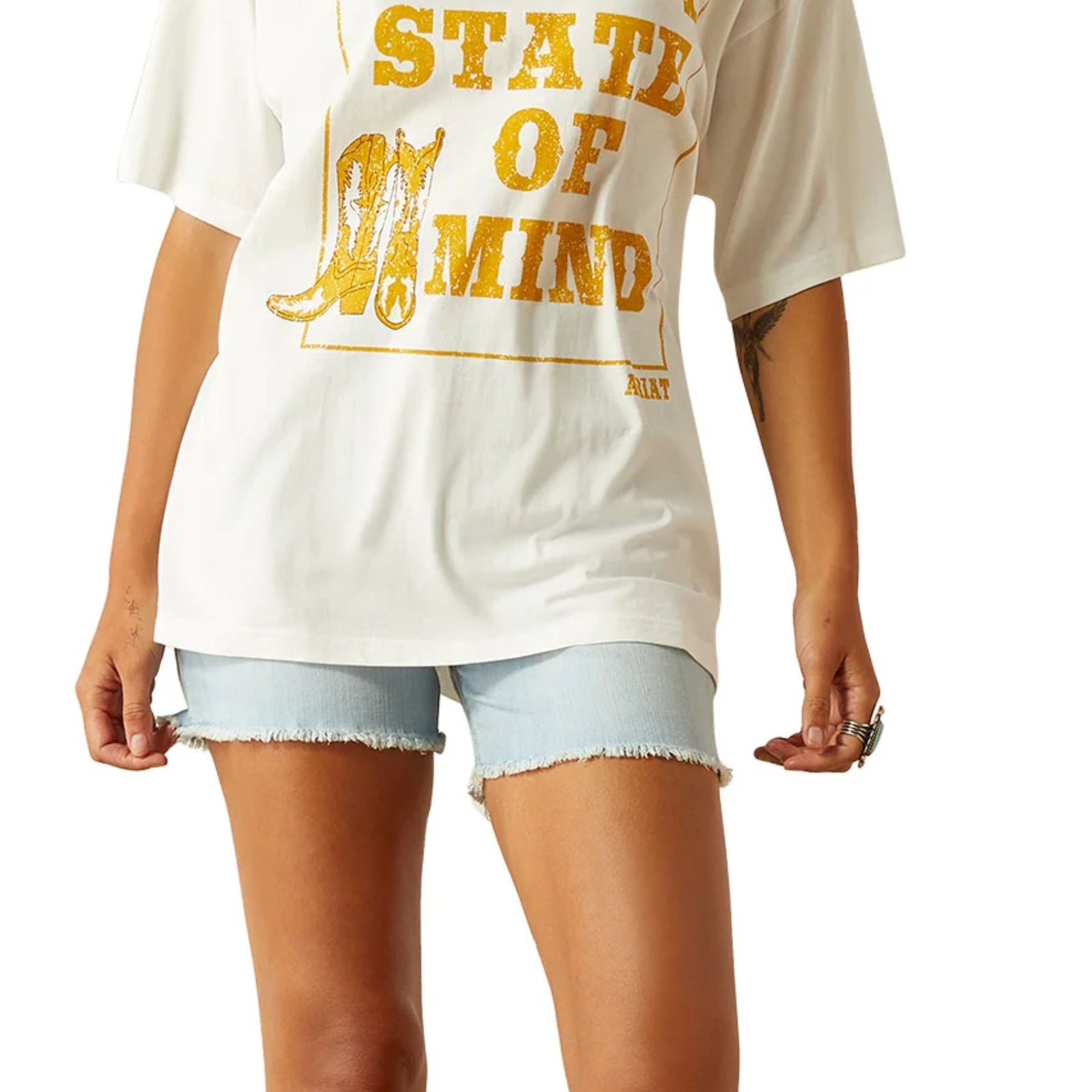 White t-shirt with yellow text and graphic, worn by a person, on a white background