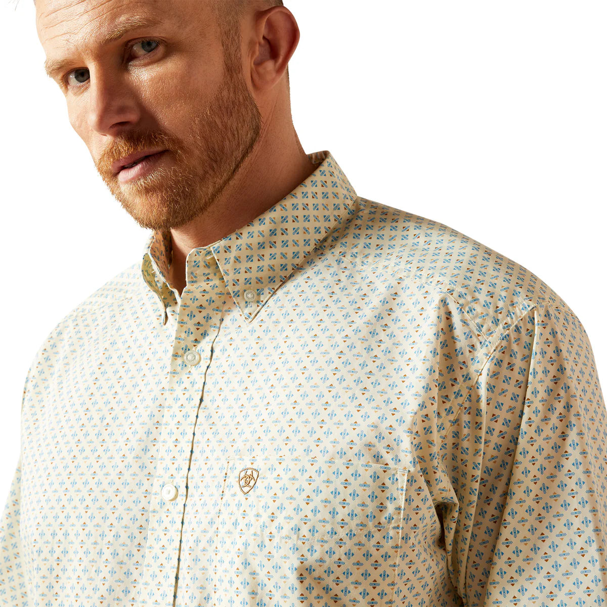 Man wearing a patterned shirt on a white background