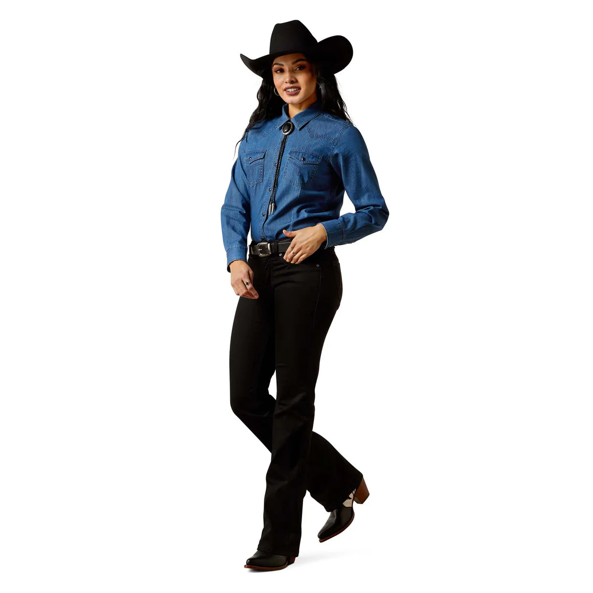 Person wearing a blue denim shirt and black pants with a cowboy hat on a white background