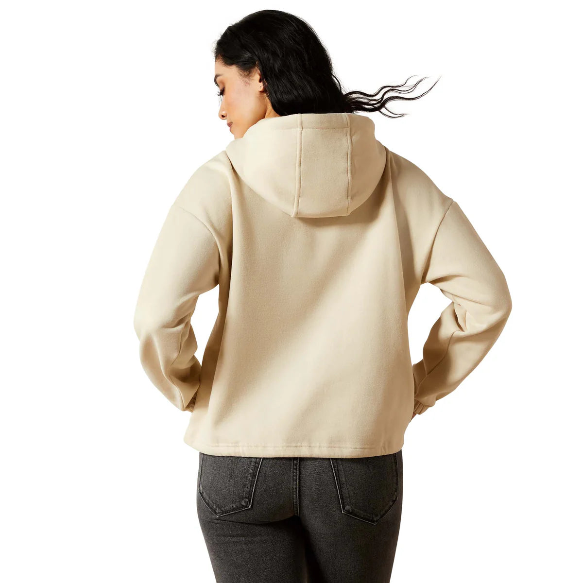 Woman wearing a beige hoodie on a white background