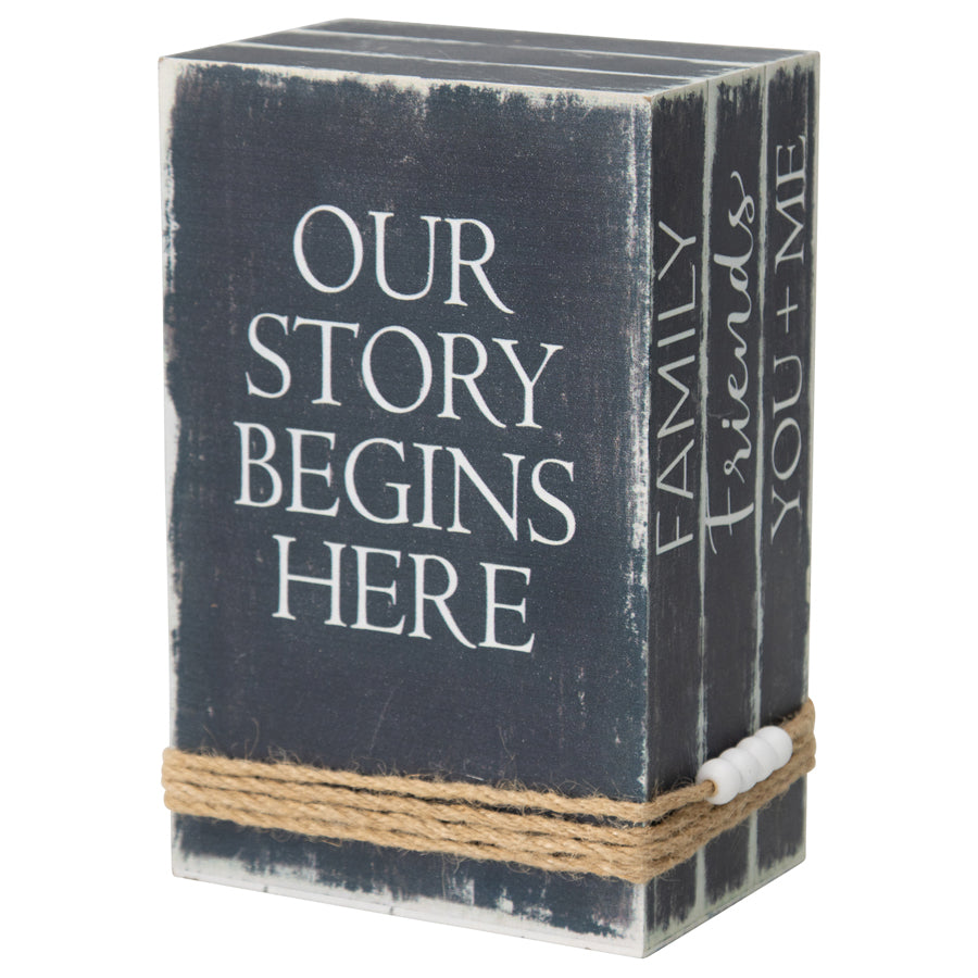Our Story Begins Here Vintage Books with Beaded Tassel. Decorative box with 'Our Story Begins Here' text on a white background