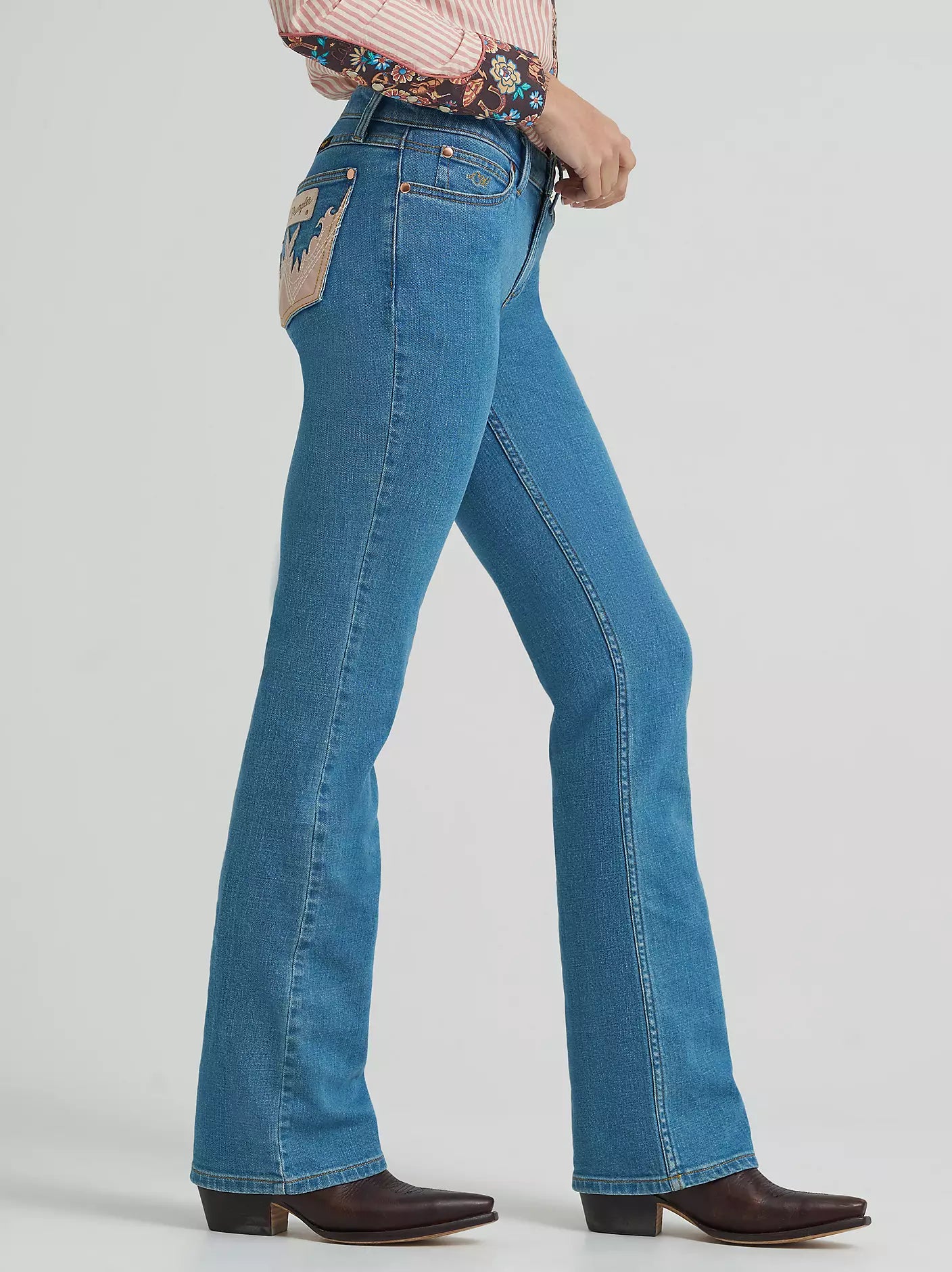 Blue jeans worn by a person on a white background