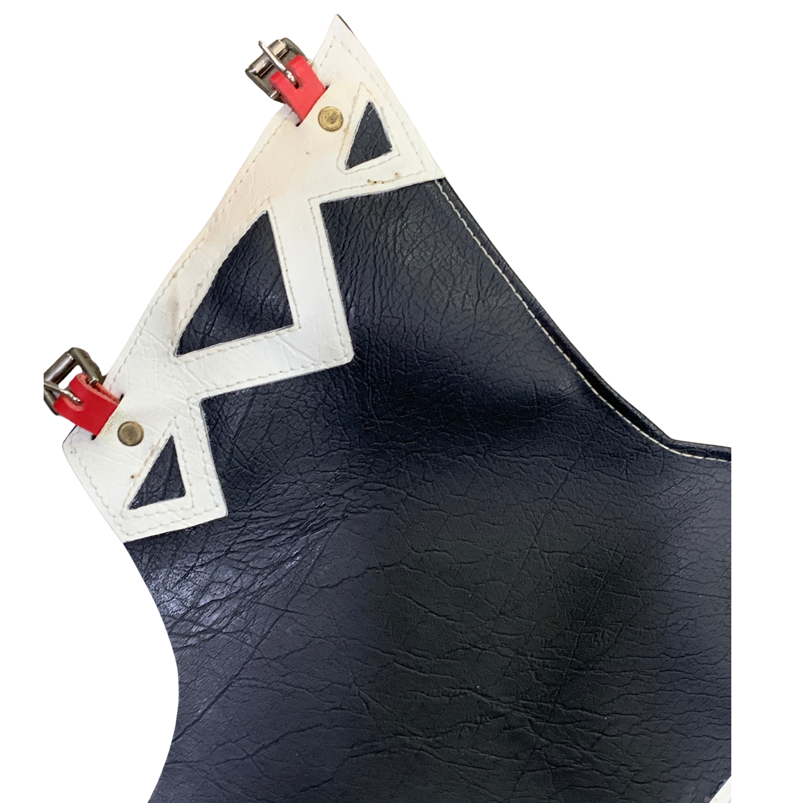 Close-up of a black textured leather accessory with white geometric trim and red buckle details on a white background.