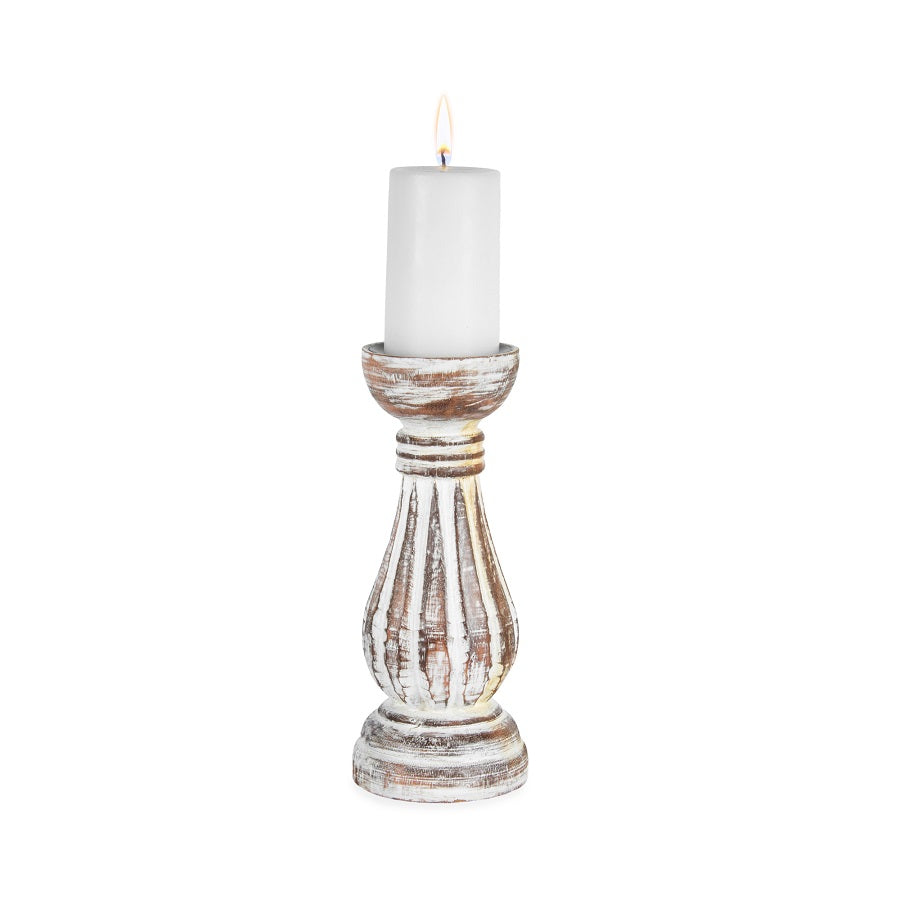 Hand Carved Candleholder. Decorative candle holder with a white candle on a white background