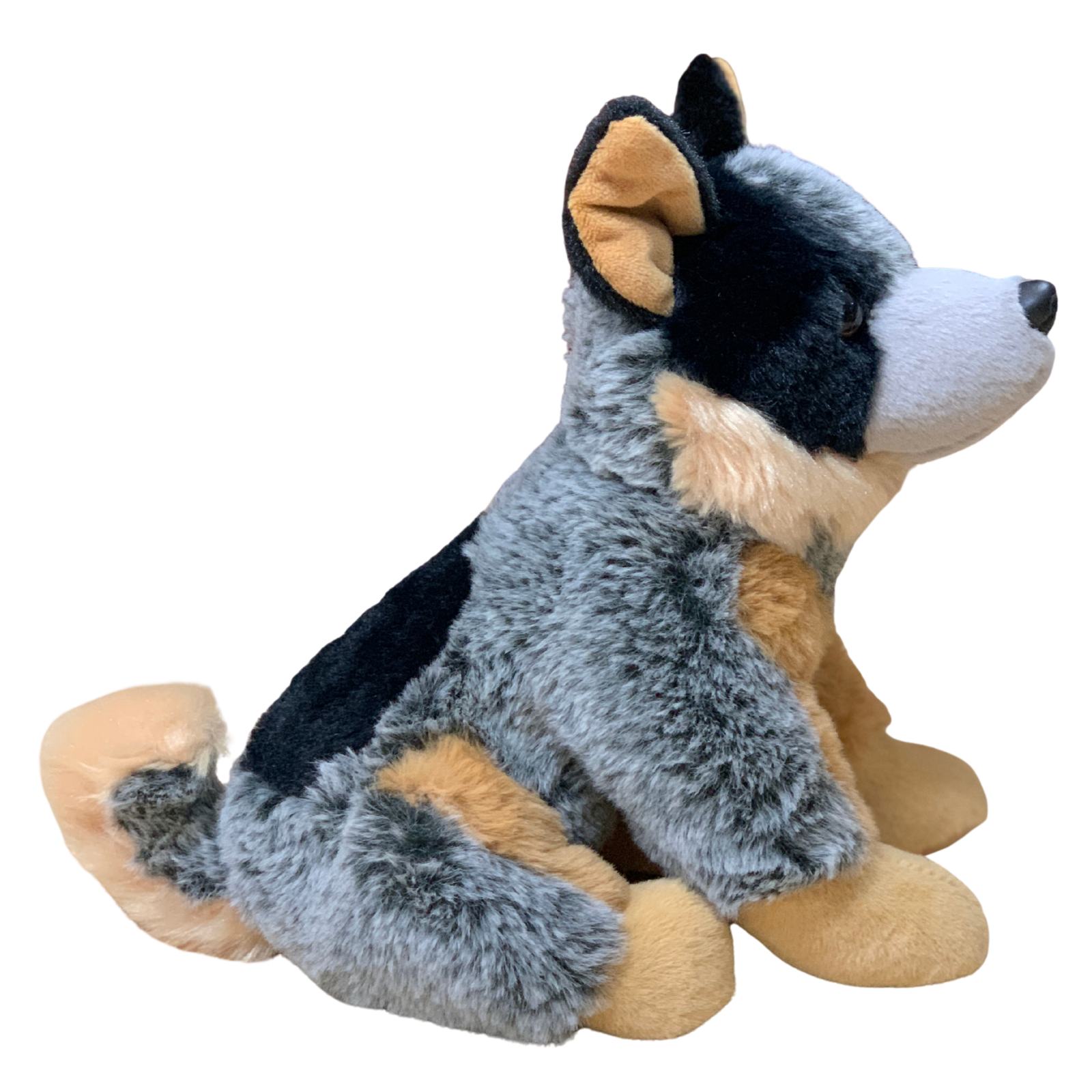 Plush toy dog with black, gray, and brown fur on a white background