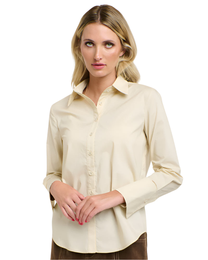 Woman wearing a 365 Women's Classic L/S Shirt. Beige button-up shirt on a white background