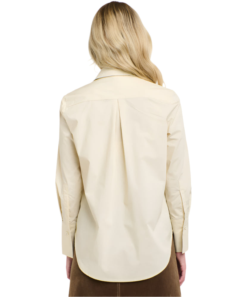 Rear view of a woman wearing a 365 Women's Classic L/S Shirt. Beige button-up shirt on a white background