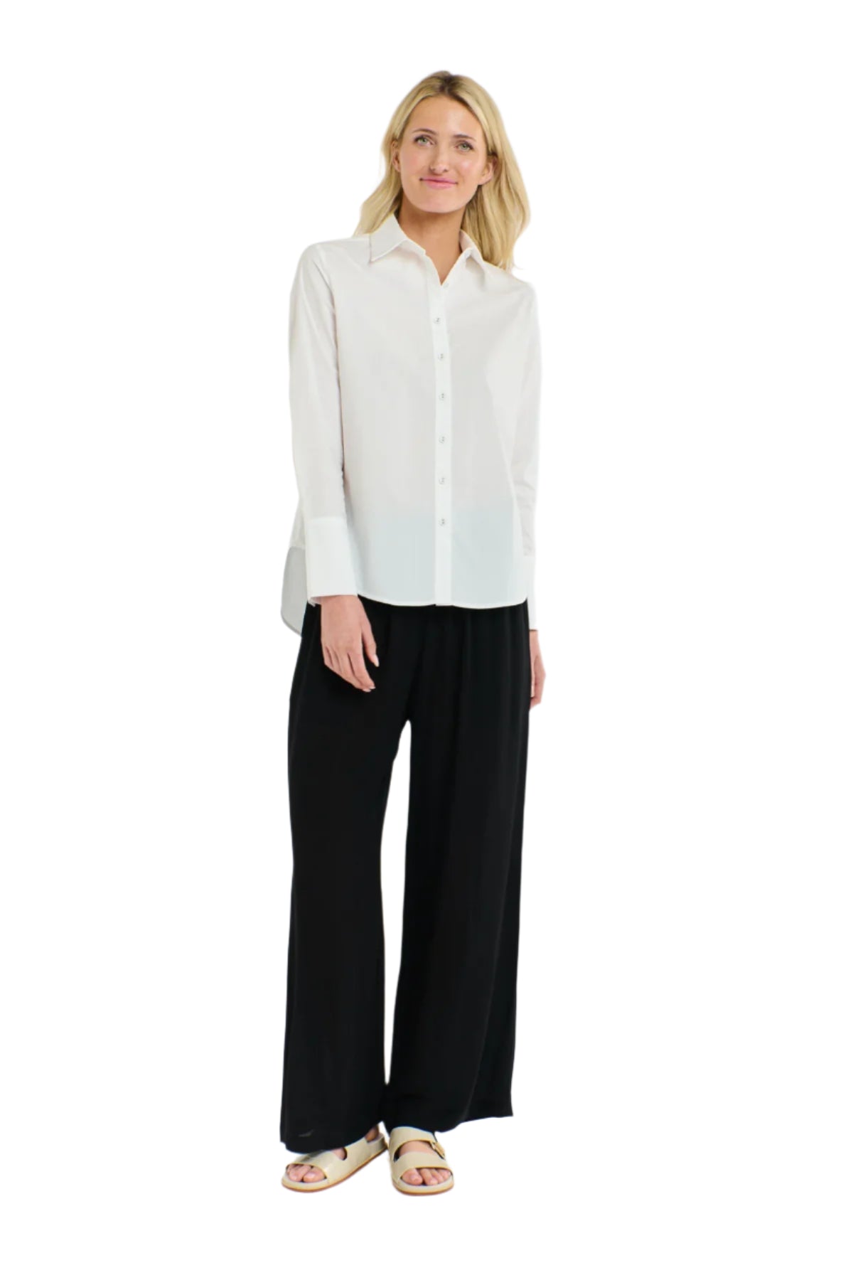 Woman wearing a 365 Women's Classic L/S Shirt. White button-up shirt on a white background