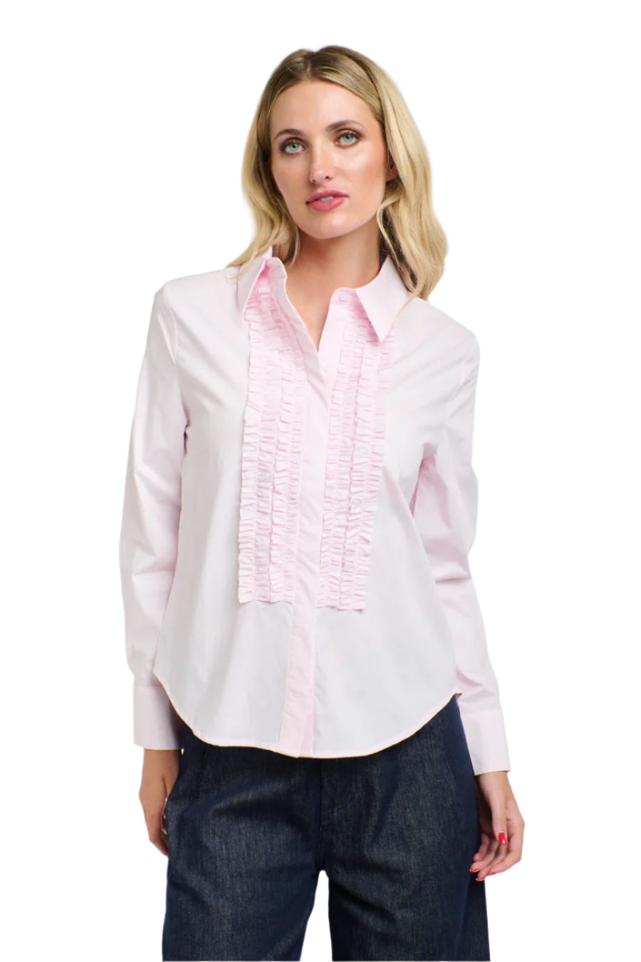Woman wearing a 365 Women's Tuxedo Shirt. A light pink blouse with ruffled details on a white background