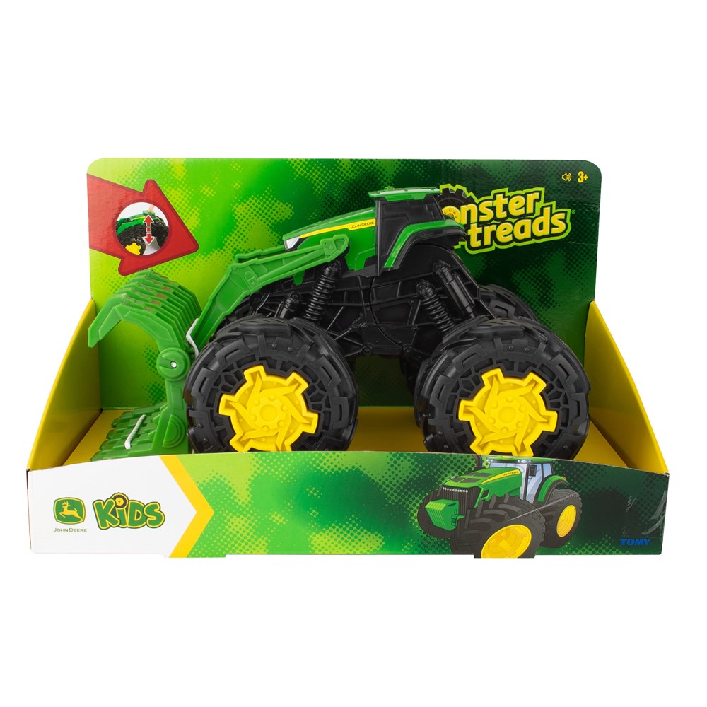 Toy monster truck in packaging with 'Monster Treads' branding on a white background