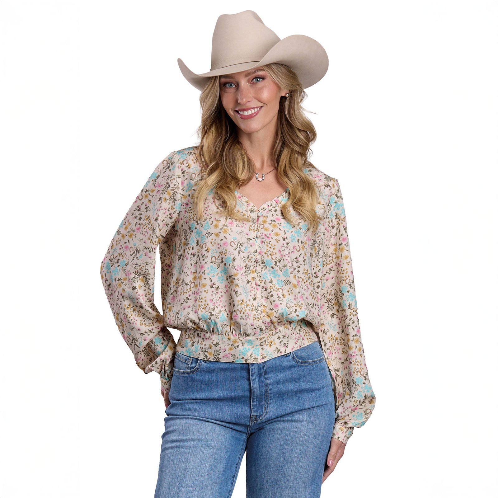 Woman wearing a floral blouse and cowboy hat on a white background