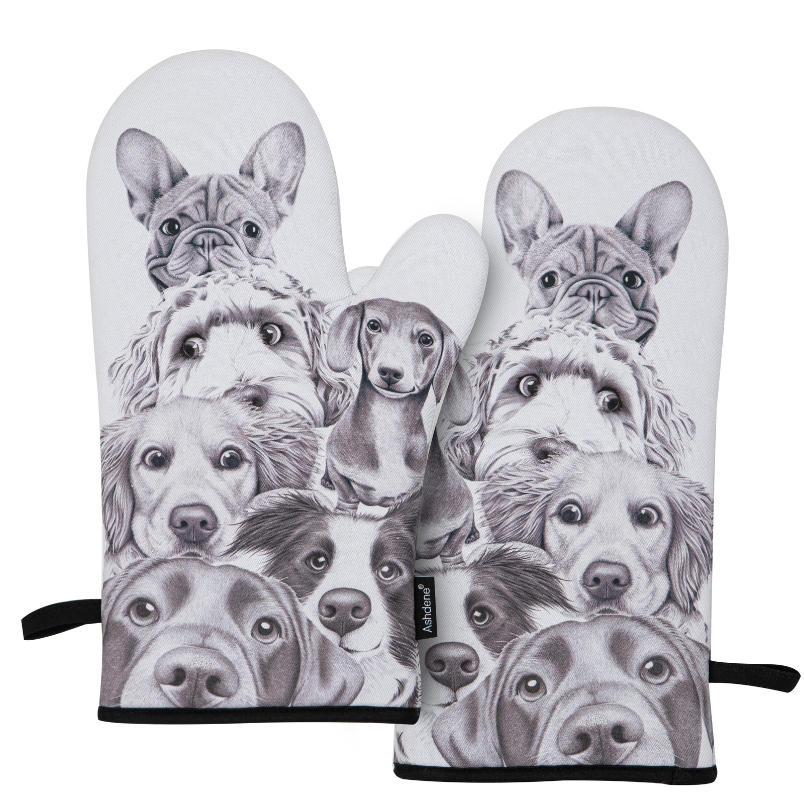 Pair of oven mitts with black and white dog illustrations on a white background