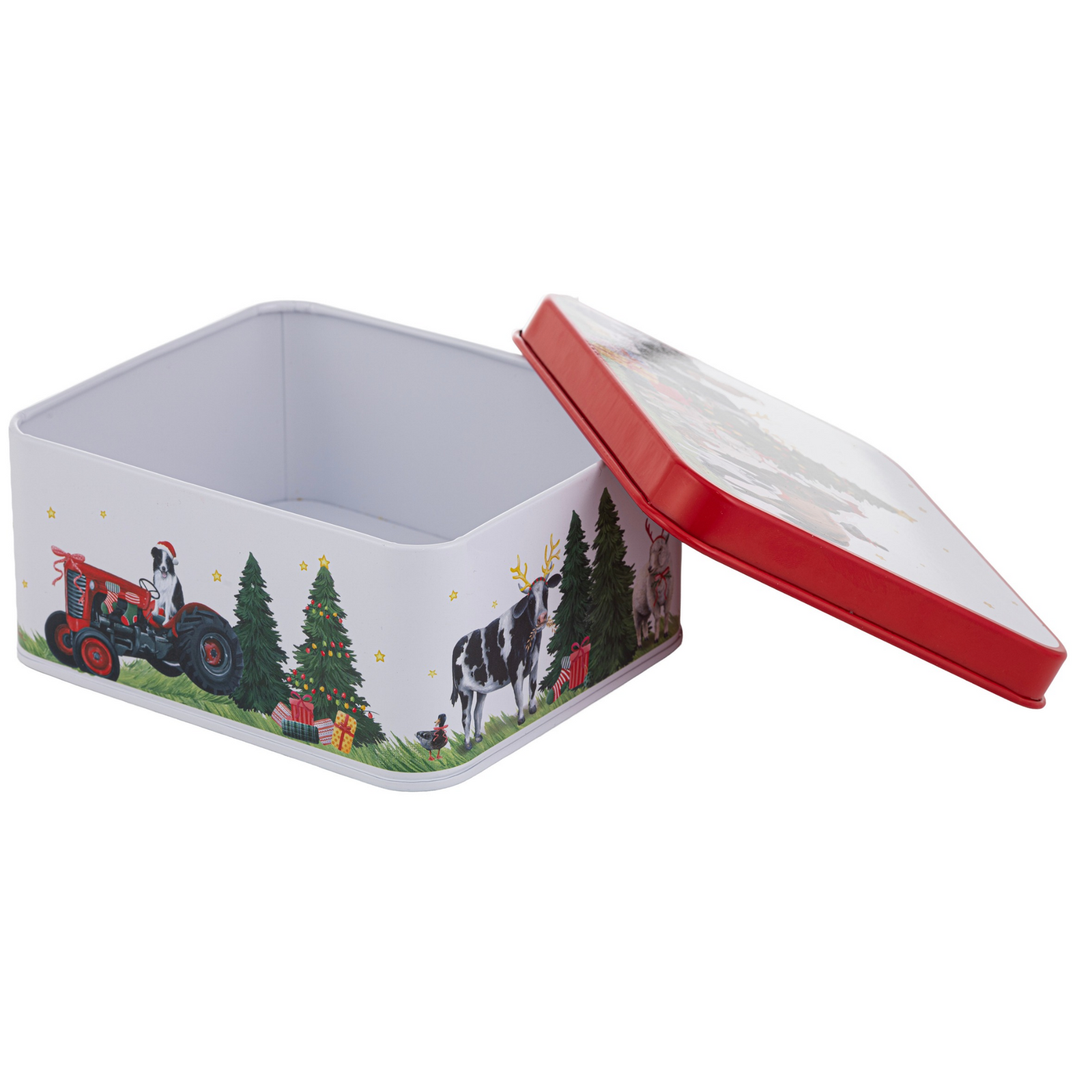 A square metal tin with a hinged lid, featuring a Christmas-themed illustration on the side of a red tractor, Christmas tree, gifts, and cows, with a solid red lid edge and white lid interior.