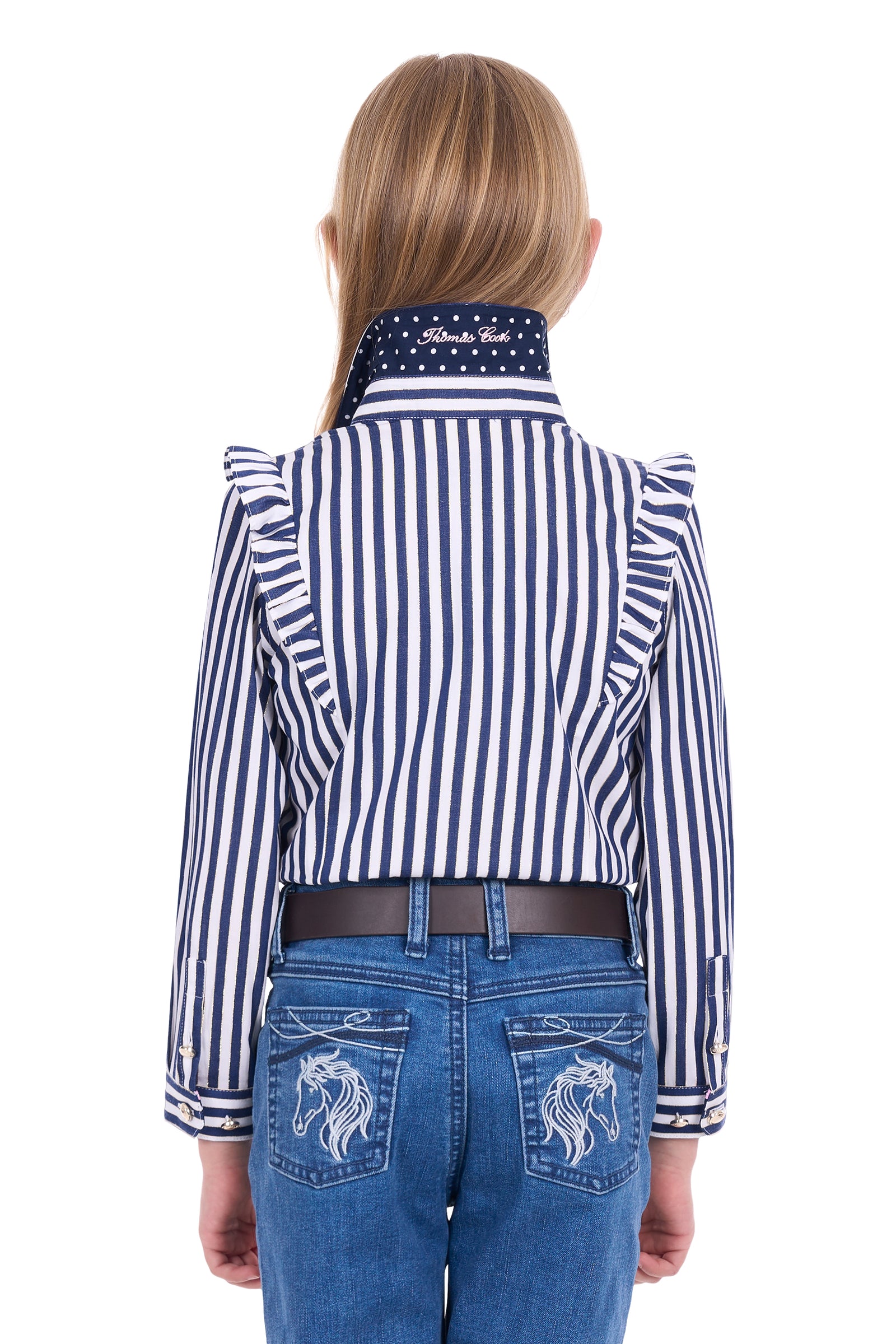 Person wearing a blue and white striped shirt with a high collar and blue jeans with horse designs.