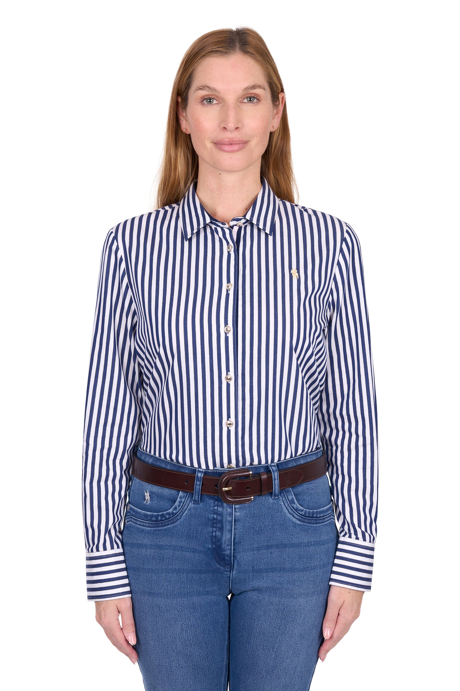 Woman wearing a blue and white striped shirt with a brown belt and blue jeans on a white background