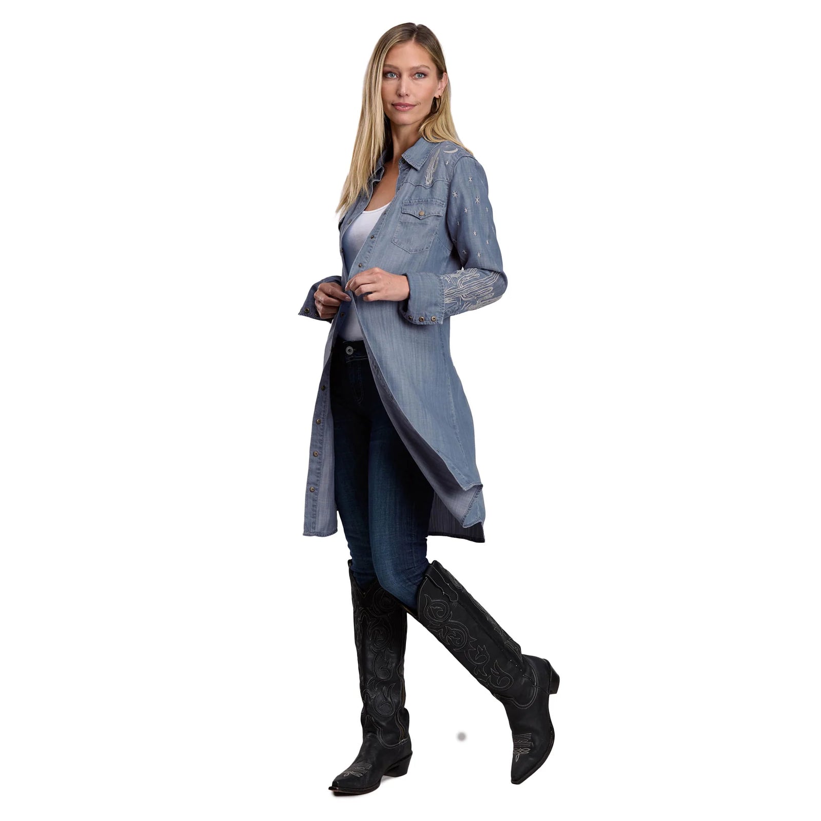 Woman wearing a long denim jacket on a white background