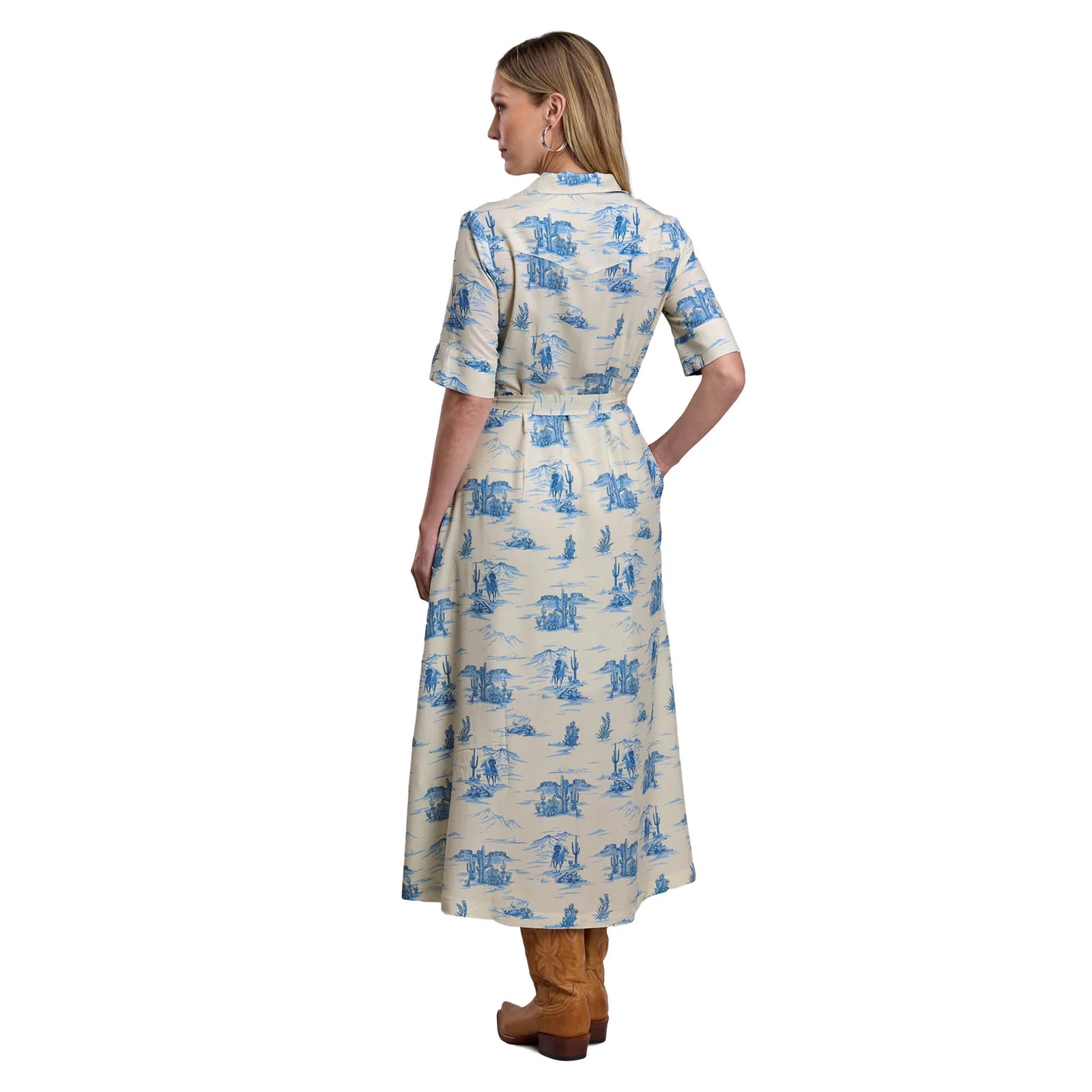 Woman wearing a blue and white patterned dress on a white background