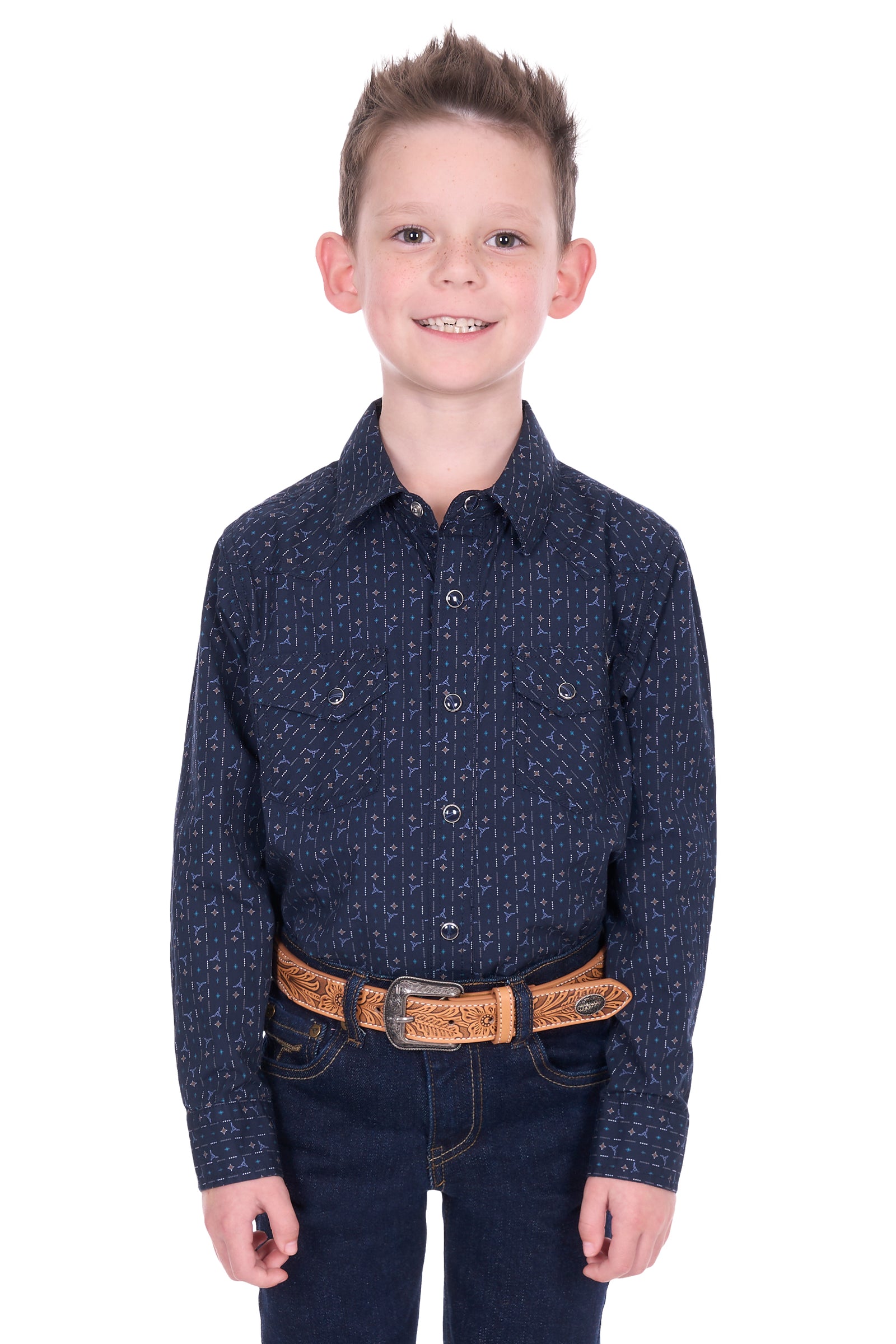 Young boy wearing a dark blue patterned shirt and jeans on a white background