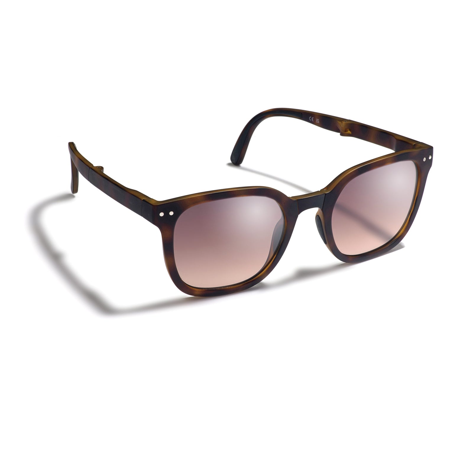 Sunglasses with tortoiseshell frame and gradient lenses on a white background