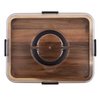 Top-down view of a rectangular wooden storage box with a clear lid, black side latches, and a circular black-and-clear vent or handle detail in the center, shown on a white background.