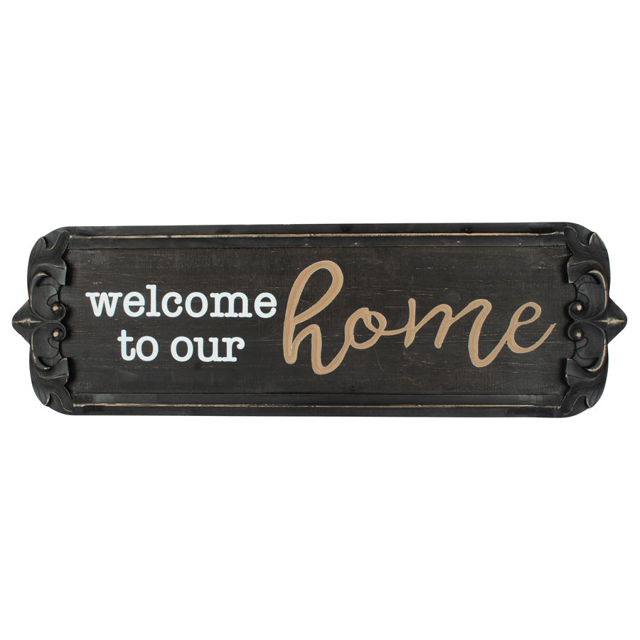 80cm Nero ‘Welcome to Our Home’ Carved Wall Art. Decorative sign with 'welcome to our home' text on a white background