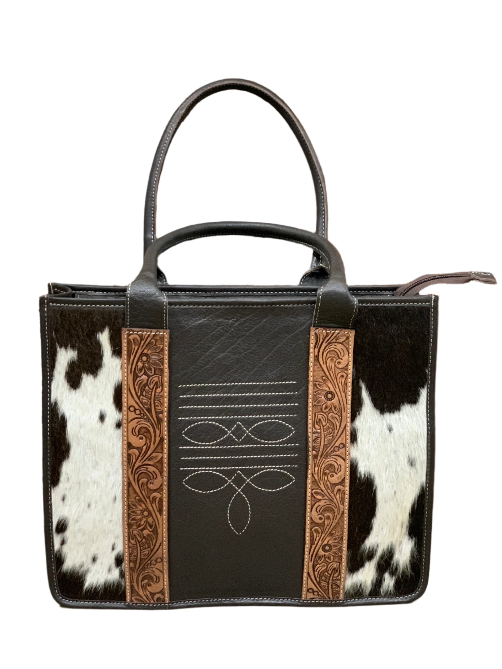Women's Norman Stitched Leather Handbag. A brown and black leather handbag with white boot stitch details and hand tooled leather on the front panel, featuring two hand held straps and a detachable shoulder strap.