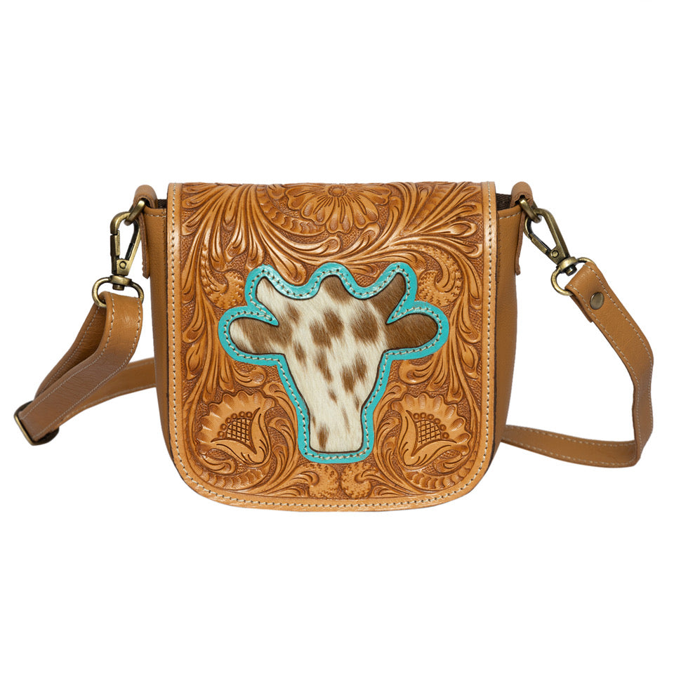 The Design Edge Women's Bullhead Sling Bag. Brown leather crossbody bag with turquoise cow skull design on a white background