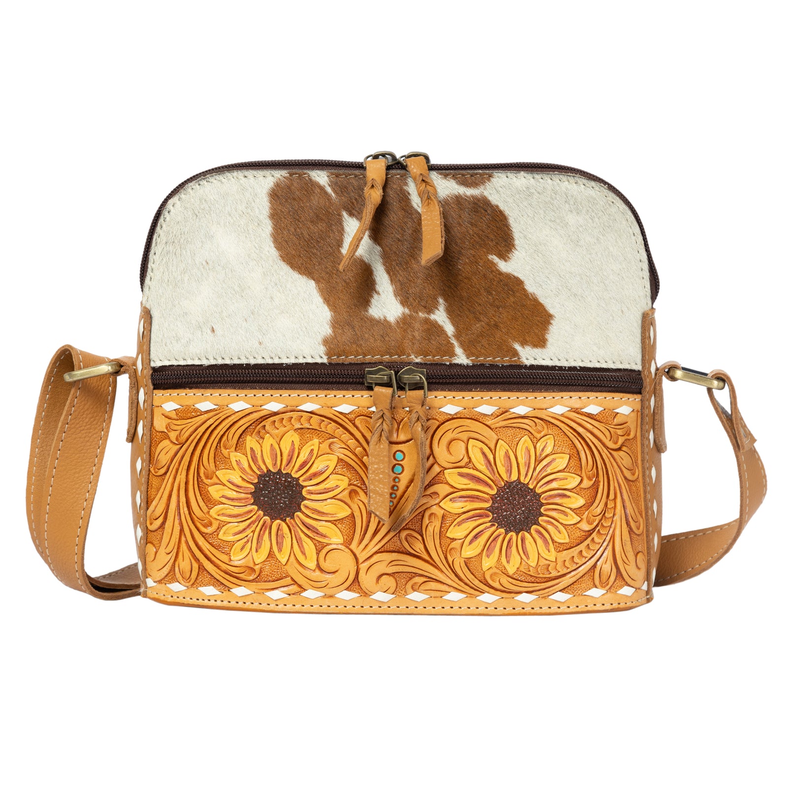 Brown and white cowhide crossbody bag with floral patterns on a white background