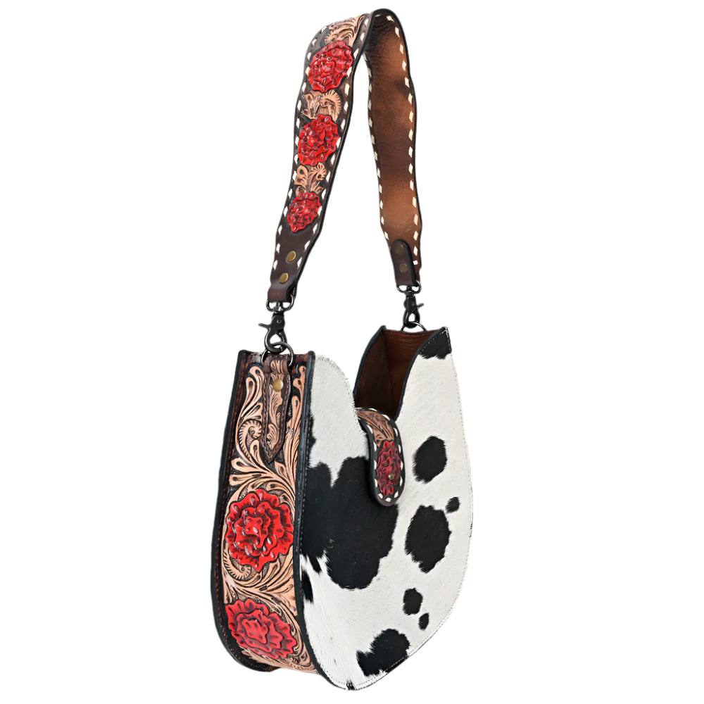 American Darling Cow hide western handbag with decorative tooled roses strap on a white background