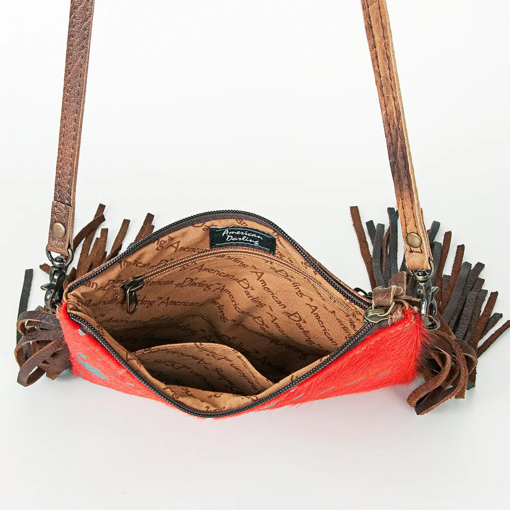 American Darling Western Olivia Hide Crossbody Bag. Red handbag with brown leather fringe and interior on a white background