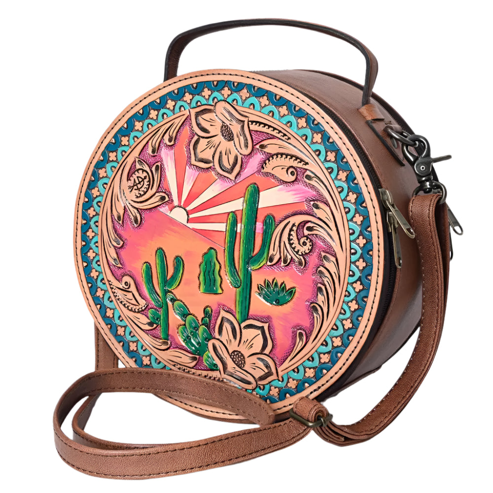 American Darling tooled leather western style handbag with a canteen shape, featuring a colorful floral and cactus pattern, solid brown background, and a brown leather shoulder strap.