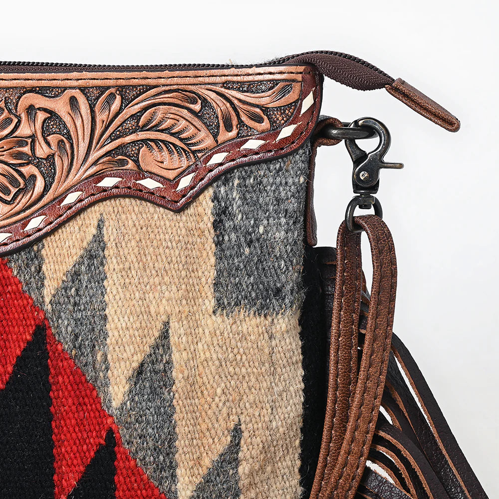 American Darling Southwestern Wool Crossbody Handbag. Close-up of a handbag with intricate leatherwork and geometric patterned fabric.