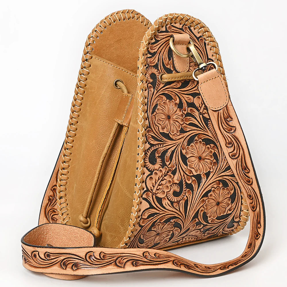 American Darling Western Floral Tooled Leather Sling Bag. Brown leather bag with intricate floral patterns on a white background