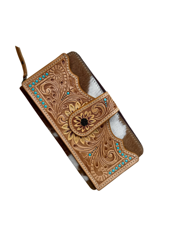 Cowhide Sunflower Tooling Leather Zippered Wallet. Brown leather phone case with intricate patterns and turquoise stones on a white background