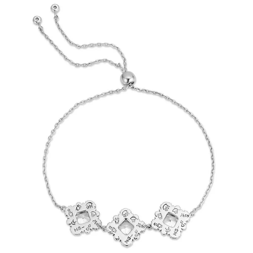 Silver bracelet with floral designs on a white background