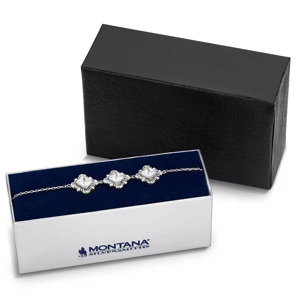 Silver bracelet in a Montana Silversmiths box with a black box in the background