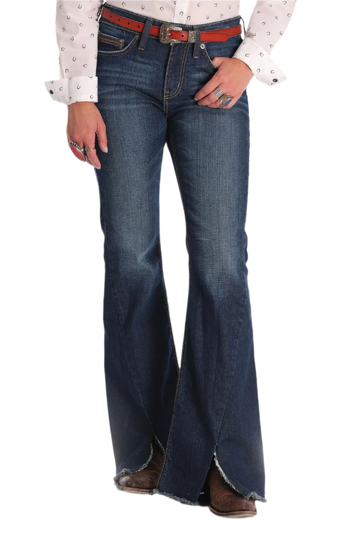 Cruel Denim Women's Hannah Slim Fit Jean. Person wearing blue flared jeans with a white shirt on a white background