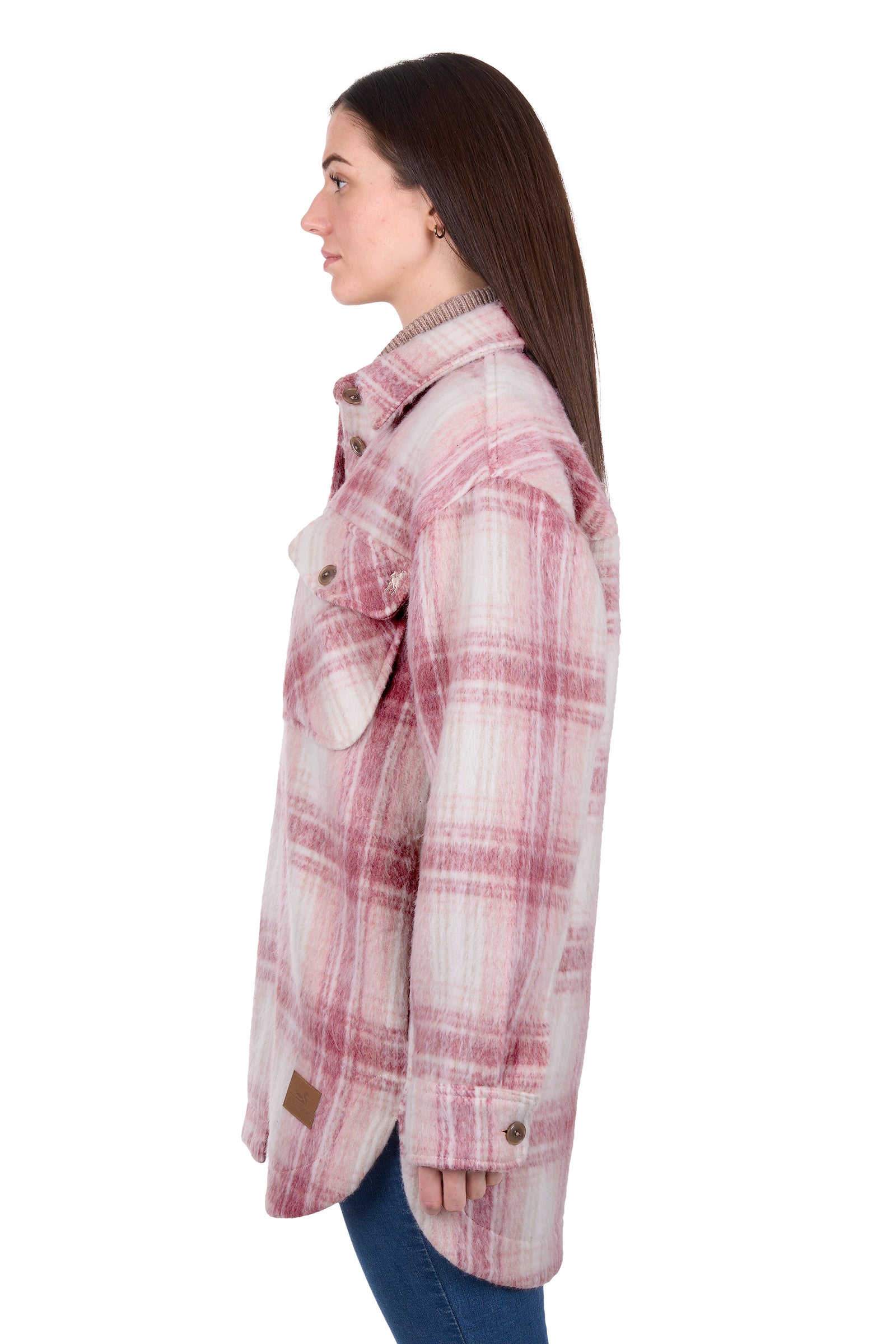Woman wearing a pink plaid jacket on a white background