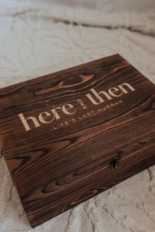 Here And Then Box - Burnt. Wooden box with engraved text on a textured surface