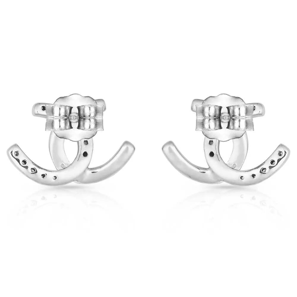 Montana Silversmiths Horseshoe Happiness Post Earrings. Pair of silver horseshoe-shaped earrings on a white background