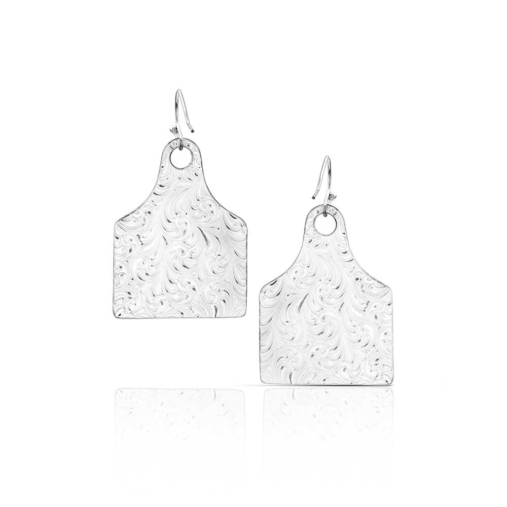 Pair of silver earrings with textured design on a white background