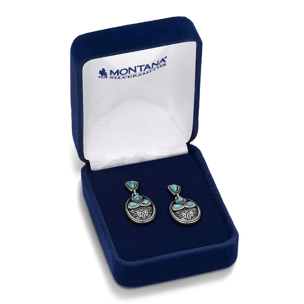 Pair of silver hoop earrings in a Montana Silversmiths box on a white background