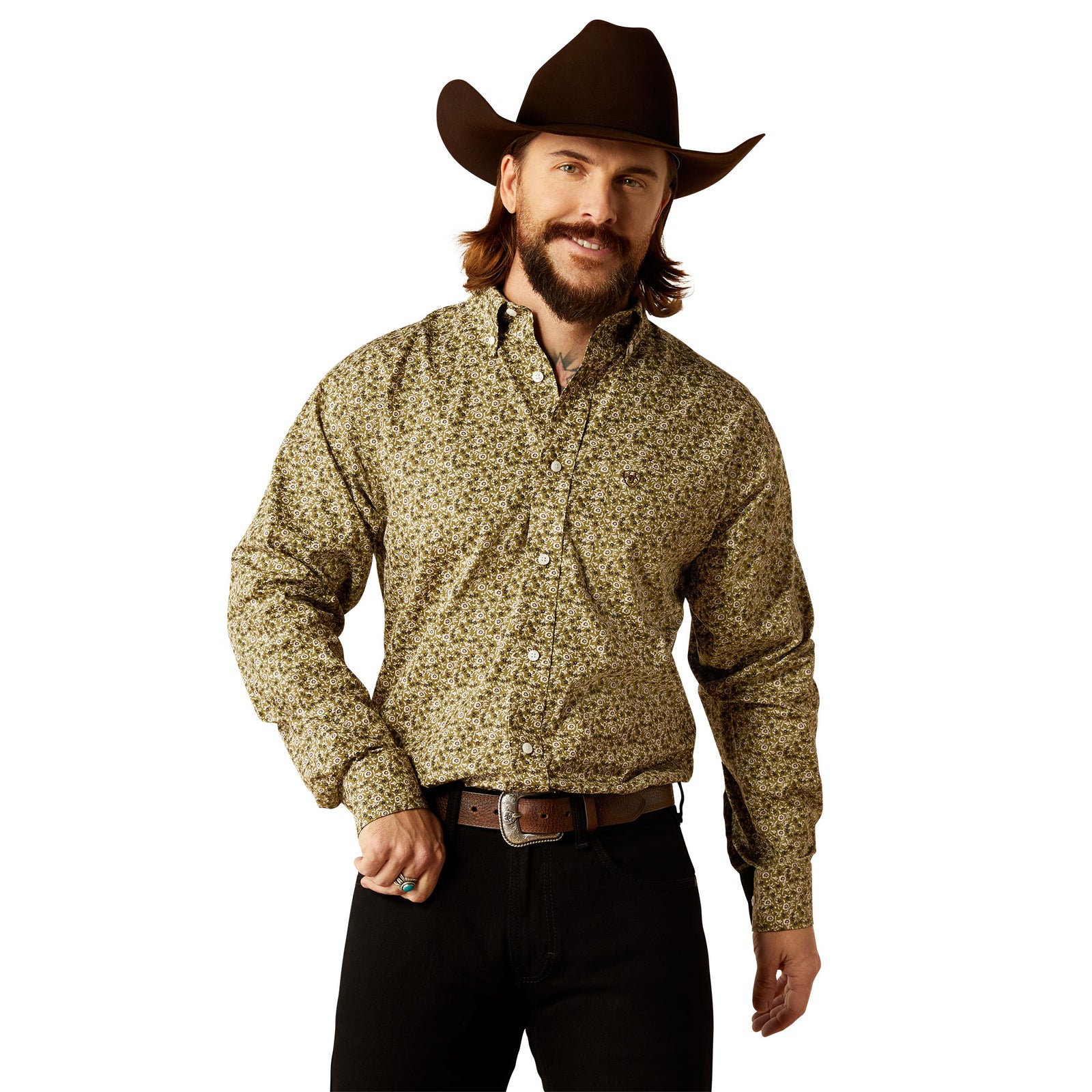 Ariat Men's Wrinkle Free Filmore L/S Western Shirt. A man wearing a Wrinkle Free Filmore long-sleeve Western shirt in beige with a floral pattern, paired with black pants and a cowboy hat.