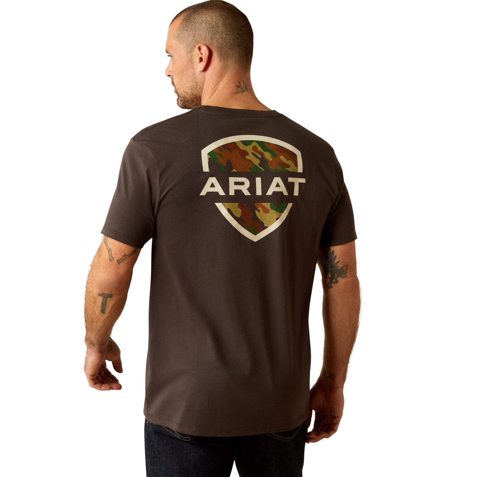 Ariat Men's Ambush Camo T-Shirt. A man wearing a brown Ariat men's T-shirt with a camo graphic on the back.