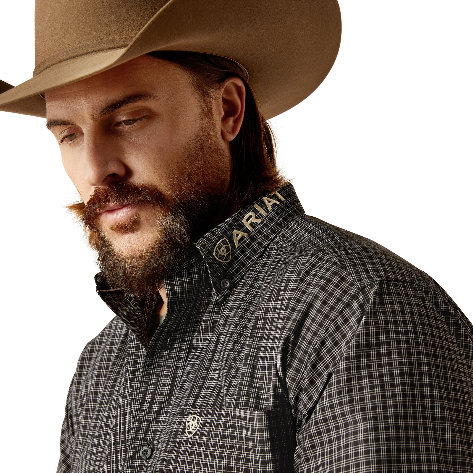Ariat Men's Pro Series Team Otto L/S Western. Man wearing a cowboy hat and plaid shirt with a plain background