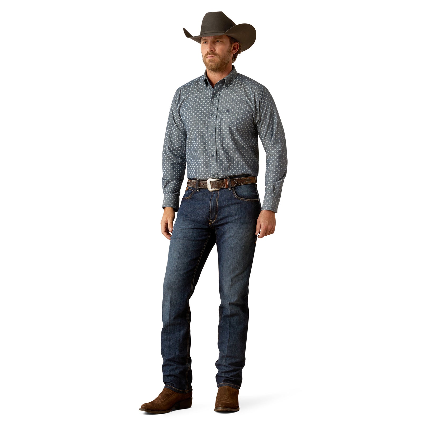 Ariat Men's Chip L/S Western Shirt. Man wearing a patterned shirt and jeans with a cowboy hat on a white background